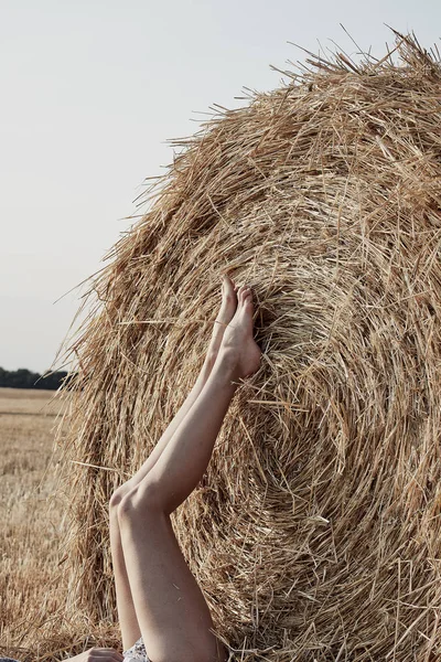 Attractive Young Barefoot Woman Lying Hay Bale Field — Stock Photo, Image