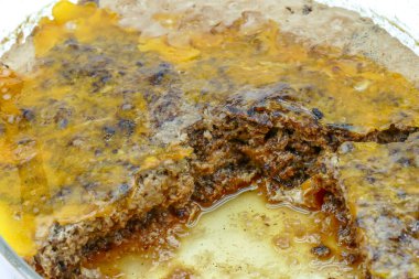 Vietnamese popular MAM, it's a blend of pork, salted fish fillet in brine, eggs. Served with white rice, sliced cucumber.