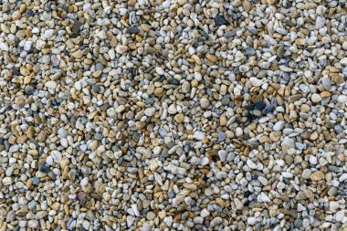Soyut arkaplanda çakıl taşlarının çeşitli şekilleri ve renkleri