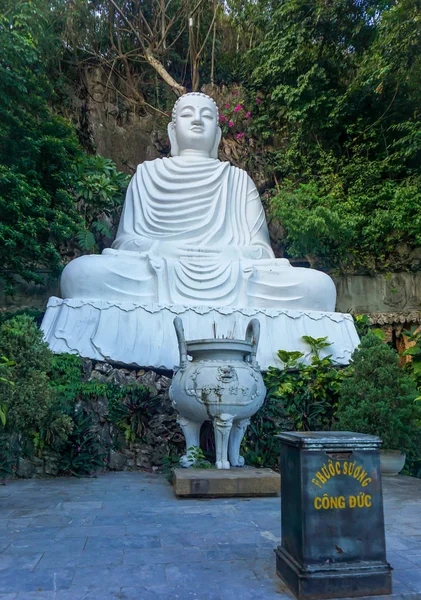 DA NANG, VIETNAM, August 05, 2015 : Big sculpture of buddha sitting with the donation box in front. Linh Ung Pagoda in Marble moutain