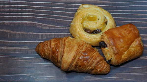 Traditional French Butter Croissant Raisin Swirl Chocolatine Wooden Background — 图库照片