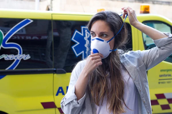 pretty brunette girl with mask to prevent corona virus disease