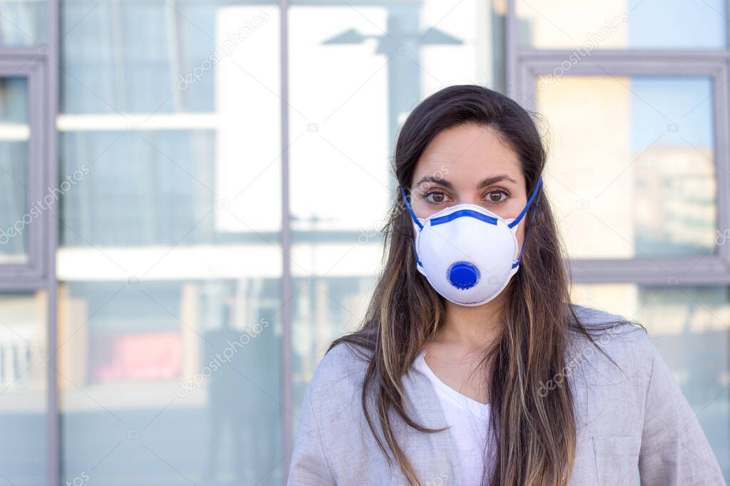 pretty brunette girl with mask to prevent corona virus disease