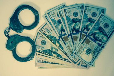 Kelepçe ve para, Amerikan doları..