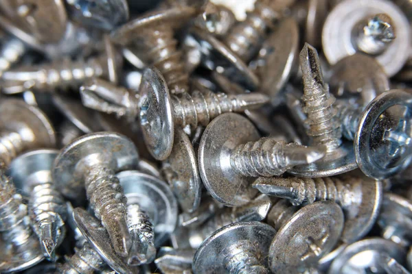 Many macro stainless self tapping screws texture — Stock Photo, Image