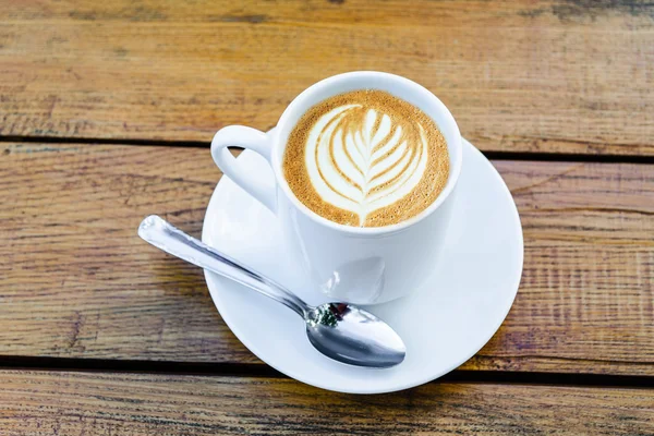 Koffiekopje latte art — Stockfoto