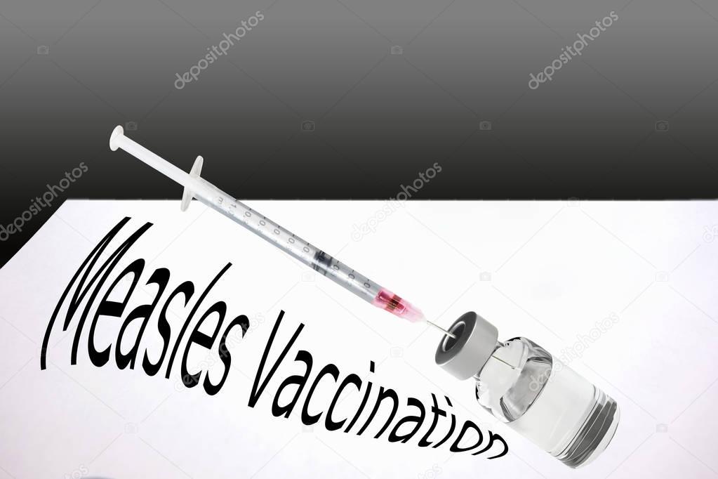 Syringe is filled with vaccine for measles vaccination.      