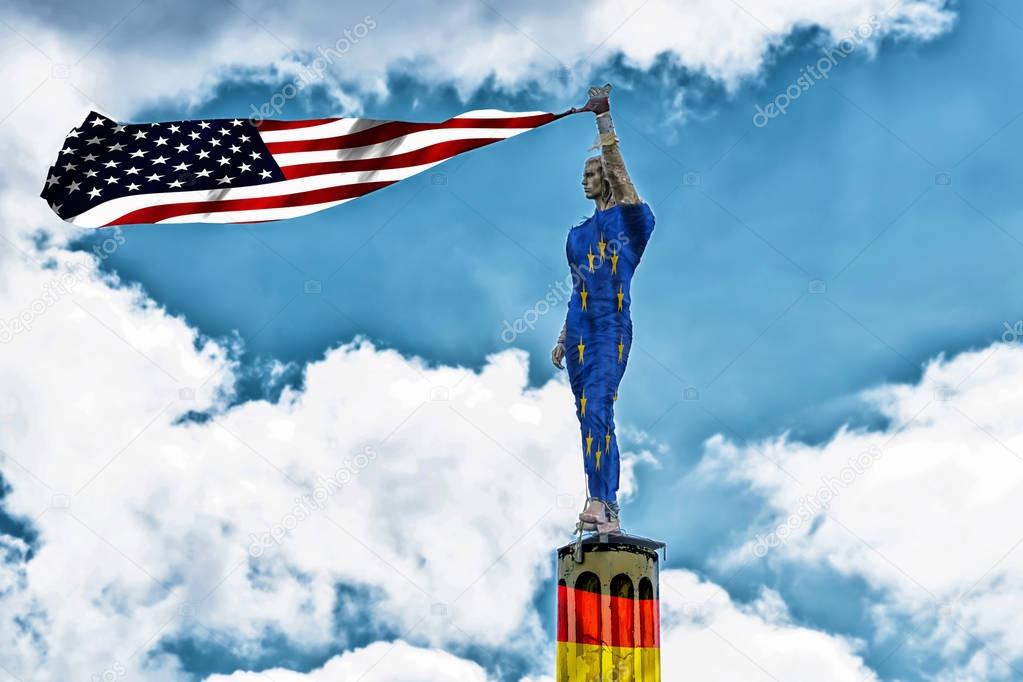 Antique stone statue wrapped in a European flag holding a USA fl