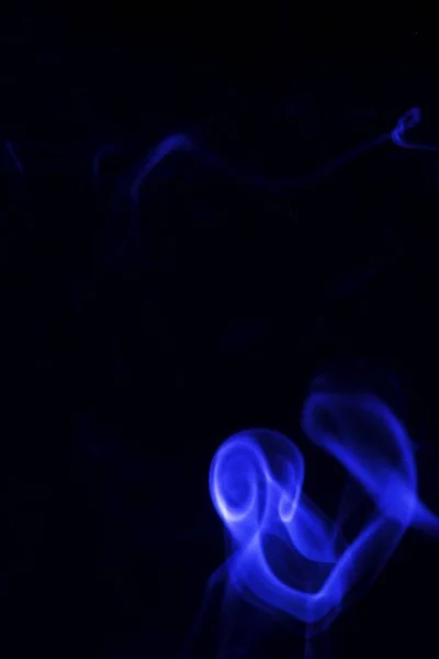 Colored smoke on a black background — Stock Photo, Image