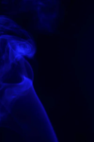 Colored smoke on a black background — Stock Photo, Image