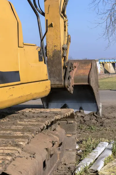 Excavating excavator on the road