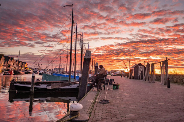 Urk Netherlands Europe, sunrise at the harbor of the small fishing village Urk 