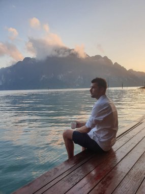 young men on vacation in Thailand visit the Khao Sok national park lake
