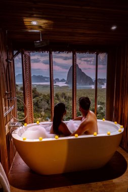 Phangnga Bay Thailand , Samet Nang She viewpoint over the bay, couple honeymoon vacation Thailand watching sunsrise