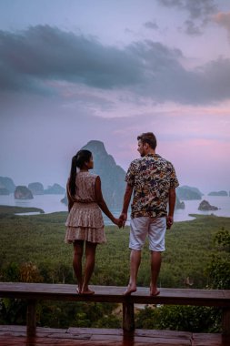 Phangnga Bay Thailand , Samet Nang She viewpoint over the bay, couple honeymoon vacation Thailand watching sunsrise