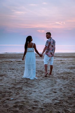 Chumphon Thailand, couple watching sunset on the beach in Thailand