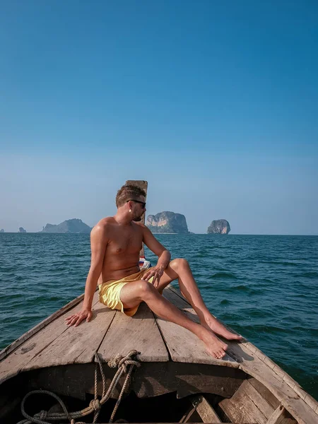 man in swim short in Krabi Thailand, guy on vacation Railay beach Ao Nang krabi Asia