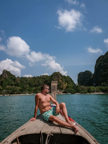 man in swim short in Krabi Thailand, guy on vacation Railay beach Ao Nang krabi Asia