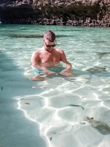 man in swim short in Krabi Thailand, guy on vacation Railay beach Ao Nang krabi Asia