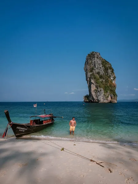 Guy in swim short on the beach of Koh poda Island Krabi Thailand, men in yellow short on the beach on a bright sunny day with blue sky — Zdjęcie stockowe