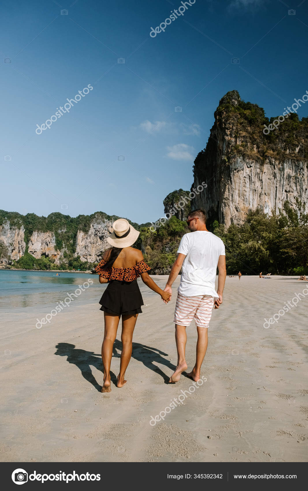 Railay Beach Krabi Thailand, a couple of men and woman on the