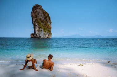 couple men and woman on the ebach, Koh Poda Krabi Thailand, white beach with crystal clear water in Krabi Thailand
