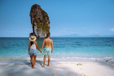couple men and woman on the ebach, Koh Poda Krabi Thailand, white beach with crystal clear water in Krabi Thailand