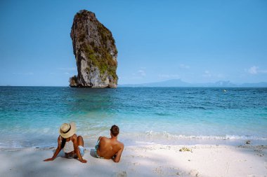 couple men and woman on the ebach, Koh Poda Krabi Thailand, white beach with crystal clear water in Krabi Thailand