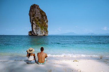 couple men and woman on the ebach, Koh Poda Krabi Thailand, white beach with crystal clear water in Krabi Thailand