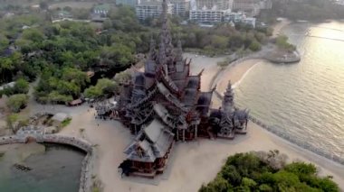 Skyline of Pattaya Thailand with wooden old historical temple during sunset Pattaya Thailand