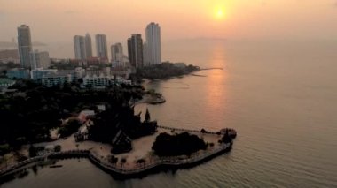 Skyline of Pattaya Thailand with wooden old historical temple during sunset Pattaya Thailand