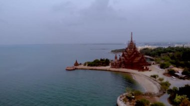 Skyline of Pattaya Thailand with wooden old historical temple during sunset Pattaya Thailand