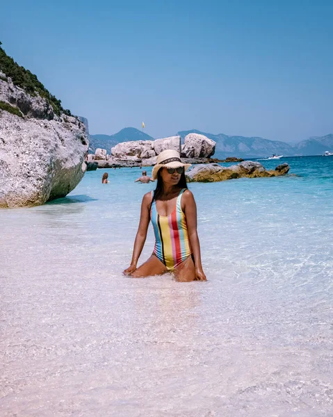 Sardinia Orosei coast Italy, woman on vacation at the Island of Sardinia on a boat trip to all the white pebble beaches some of the most beautiful beaches in Europe — Stock fotografie