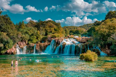 KRKA waterfalls Croatia September , krka national park Croatia on a bright summer evening with people relaxing in the water