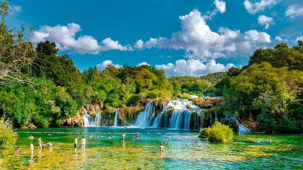 KRKA waterfalls Croatia September , krka national park Croatia on a bright summer evening with people relaxing in the water — Stock Photo, Image