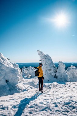 Harz national park Germany, historic steam train in the winter, Drei Annen Hohe, Germany,Steam locomotive of the Harzer Schmallspurbahnen in wintertime with snow.