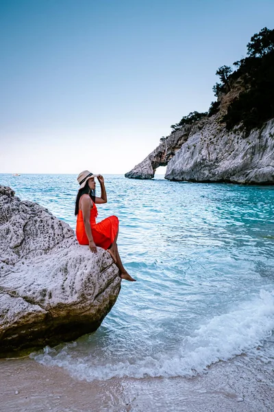 Sardinia Orosei coast Italy, woman on vacation at the Island of Sardinia on a boat trip to all the white pebble beaches some of the most beautiful beaches in Europe — 스톡 사진