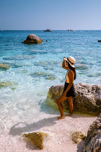 Sardinia Orosei coast Italy, woman on vacation at the Island of Sardinia on a boat trip to all the white pebble beaches some of the most beautiful beaches in Europe — Stockfoto