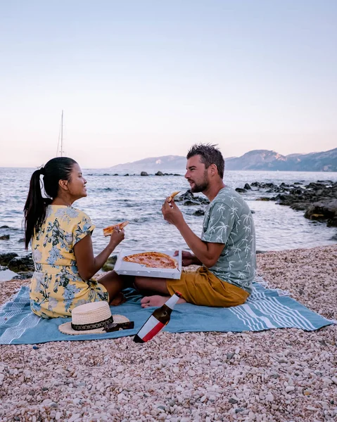 Sardinia Orosei coast Italy, men and woman, young couple adult on vacation at the Island of Sardinia on a boat trip to all the white pebble beaches some of the most beautiful beaches in Europe — Stockfoto