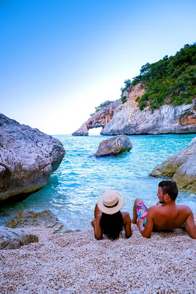 Sardinia Orosei coast Italy, men and woman, young couple adult on vacation at the Island of Sardinia on a boat trip to all the white pebble beaches some of the most beautiful beaches in Europe — 图库照片