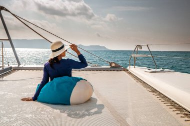 Seychelles, young men on vacation with sailing boat at the Seychelles tropical island