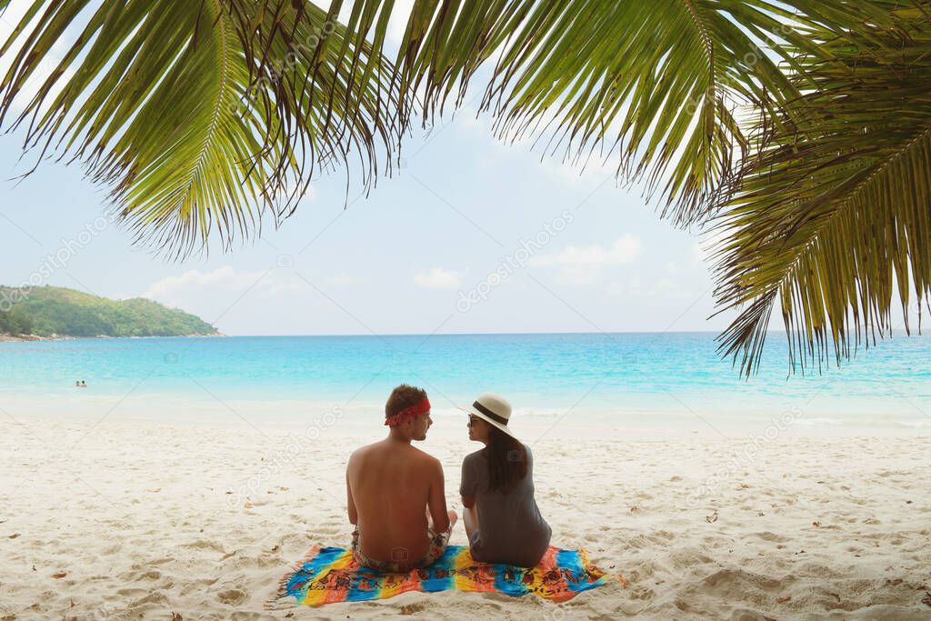 Seychelles tropical Island, Young woman and men on the white beach during Holiday vacation Mahe Seychelles, Praslin Seychelles