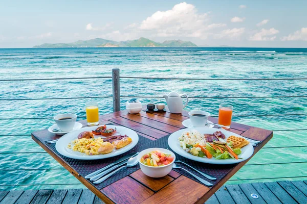 Breakfast on the beach by the pool with a look over the ocean of La Digeu Seychelles