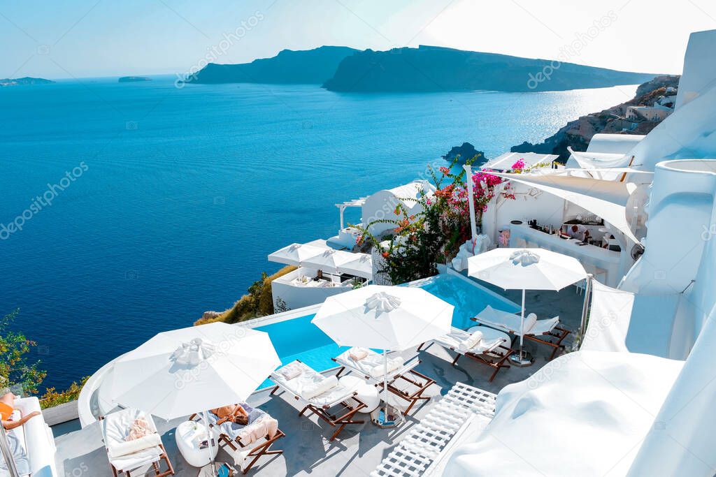 Santorini Oia village during sunset whit luxury hotels and whitewashed buildings in Santorini Island a luxury vacation destination in Greece