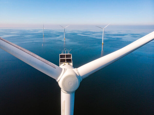 Wind turbine from aerial view, Drone view at windpark westermeerdijk a windmill farm in the lake IJsselmeer the biggest in the Netherlands,Sustainable development, renewable energy