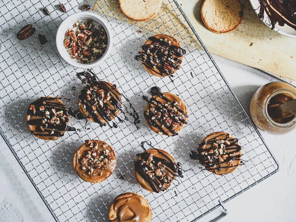 Top view of almond cookies with vegan caramel and chocolate