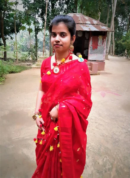 Indian village people in red dress.