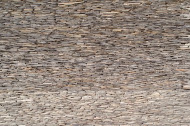 Taş kiremit duvar dokusu. Duvarın bir parçası. Yığılmış taş duvar arkaplanı.