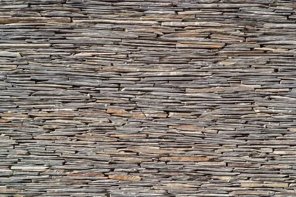 Taş kiremit duvar dokusu. Duvarın bir parçası. Yığılmış taş duvar arkaplanı.