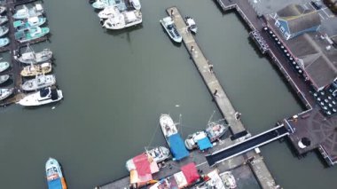 Aerial view of fishermen's boats in the marina and the boardwalk